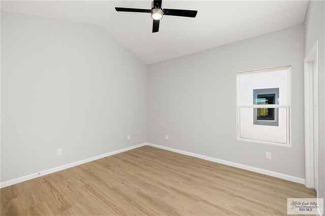 empty room with light wood-type flooring, ceiling fan, and lofted ceiling