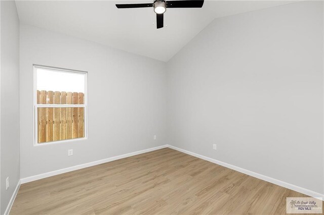 unfurnished room with ceiling fan, light hardwood / wood-style flooring, and vaulted ceiling