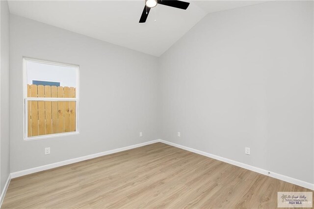 spare room with light hardwood / wood-style flooring, ceiling fan, and lofted ceiling