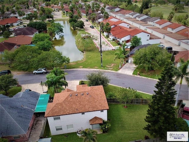 bird's eye view featuring a water view and a residential view