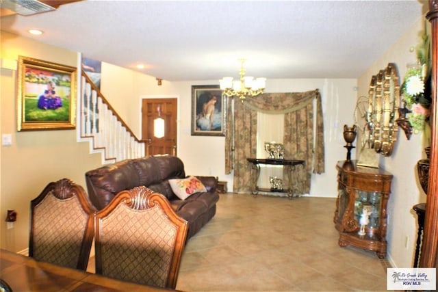 living room with a notable chandelier, stairs, visible vents, and recessed lighting