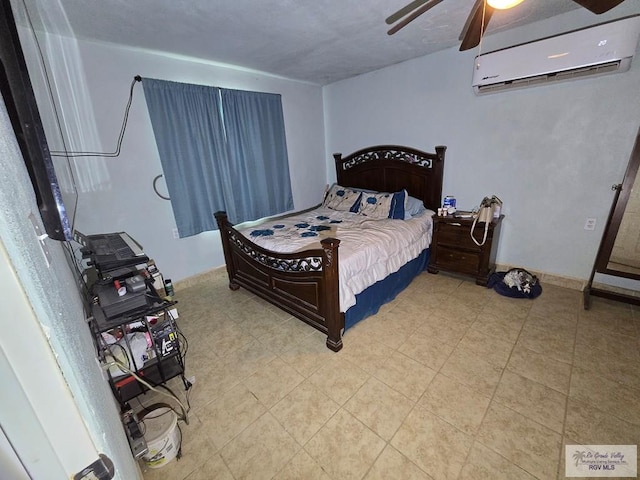 29647 Adams Rd, San Benito, TX 78586 - bedroom with an AC wall unit, ceiling fan, and light tile patterned flooring