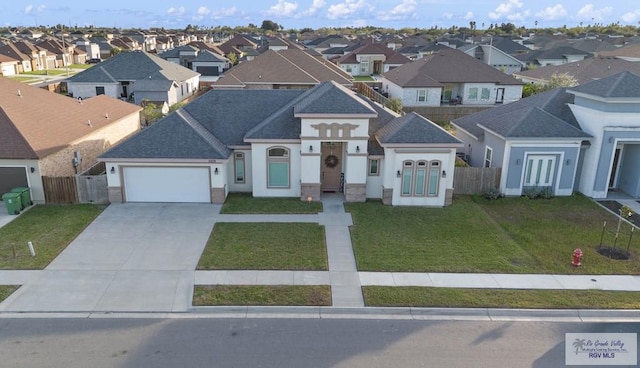 view of front facade featuring a garage and a front yard