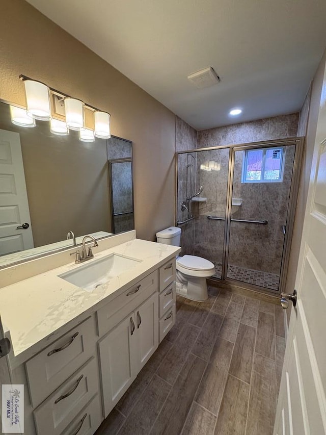 118 E Matz Ave, Harlingen, TX 78550 - full bath featuring vanity, a shower stall, and wood finish floors