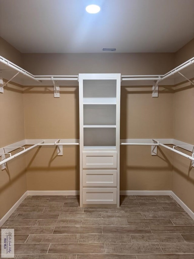 118 E Matz Ave, Harlingen, TX 78550 - walk in closet featuring wood finish floors