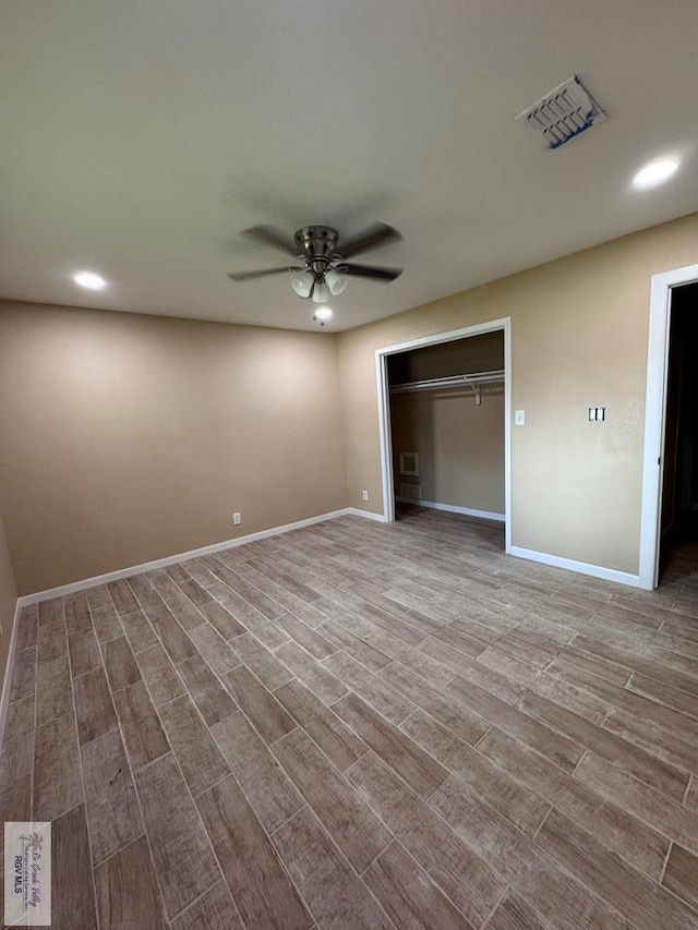 118 E Matz Ave, Harlingen, TX 78550 - unfurnished bedroom with wood finished floors, recessed lighting, a closet, and ceiling fan