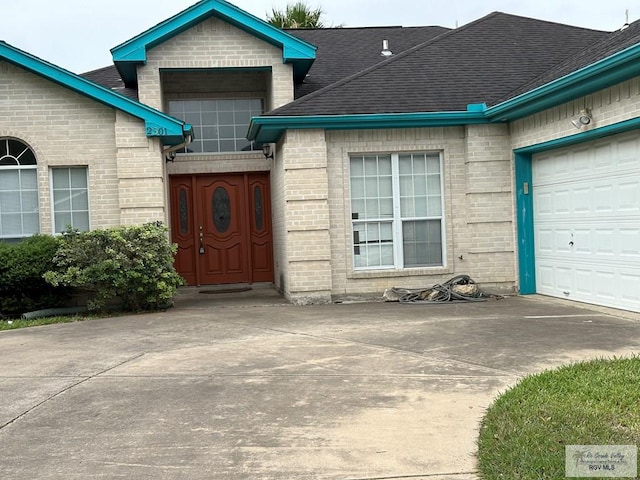 view of exterior entry featuring a garage