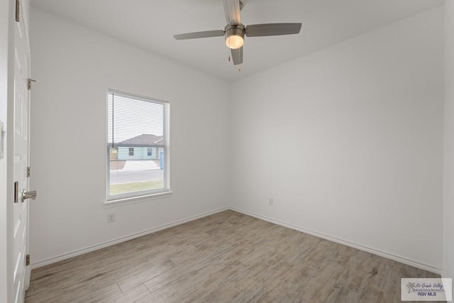 spare room featuring ceiling fan and light hardwood / wood-style floors