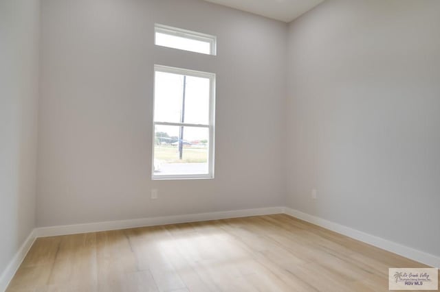 spare room with light hardwood / wood-style floors