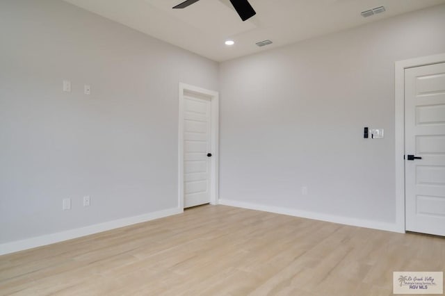 spare room with ceiling fan and light hardwood / wood-style flooring