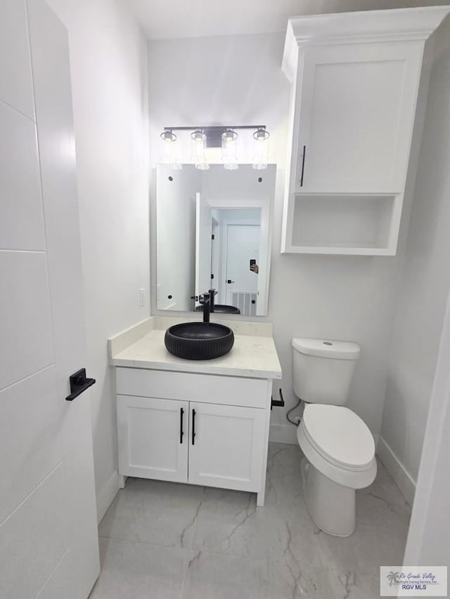 121 Finch Dr, Los Fresnos, TX 78566 - bathroom with marble finish flooring and vanity