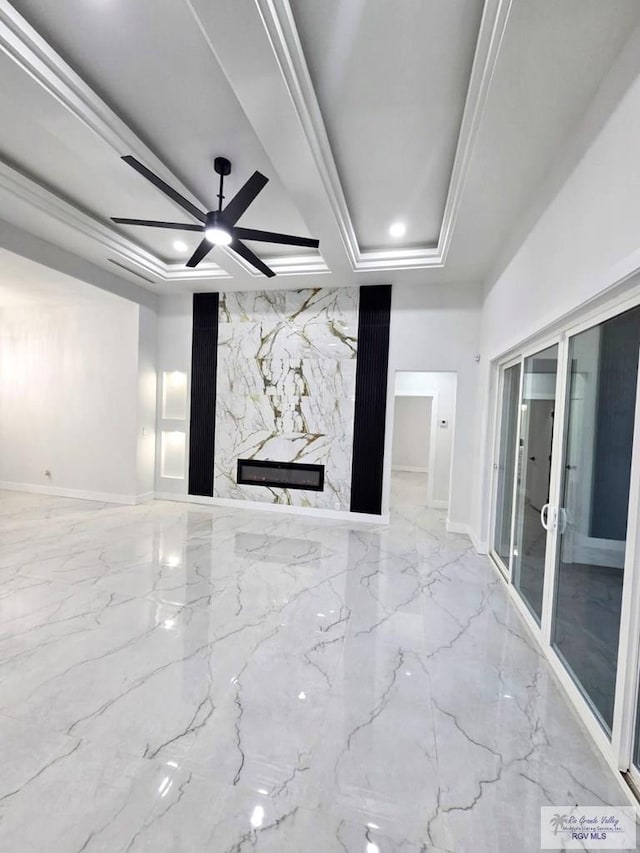 121 Finch Dr, Los Fresnos, TX 78566 - unfurnished living room with ornamental molding, french doors, a high end fireplace, a ceiling fan, and marble tiled flooring