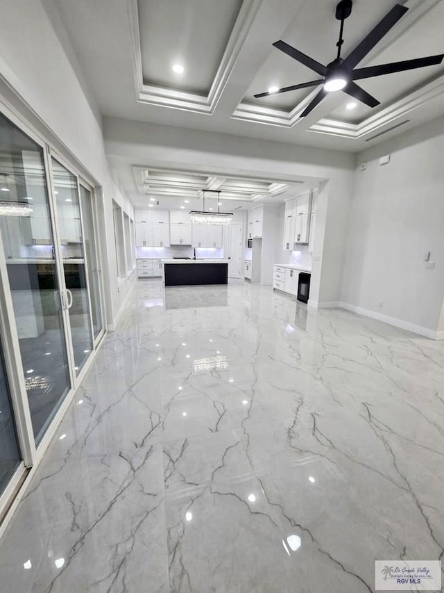 121 Finch Dr, Los Fresnos, TX 78566 - unfurnished living room featuring light marble finish floors and coffered ceiling