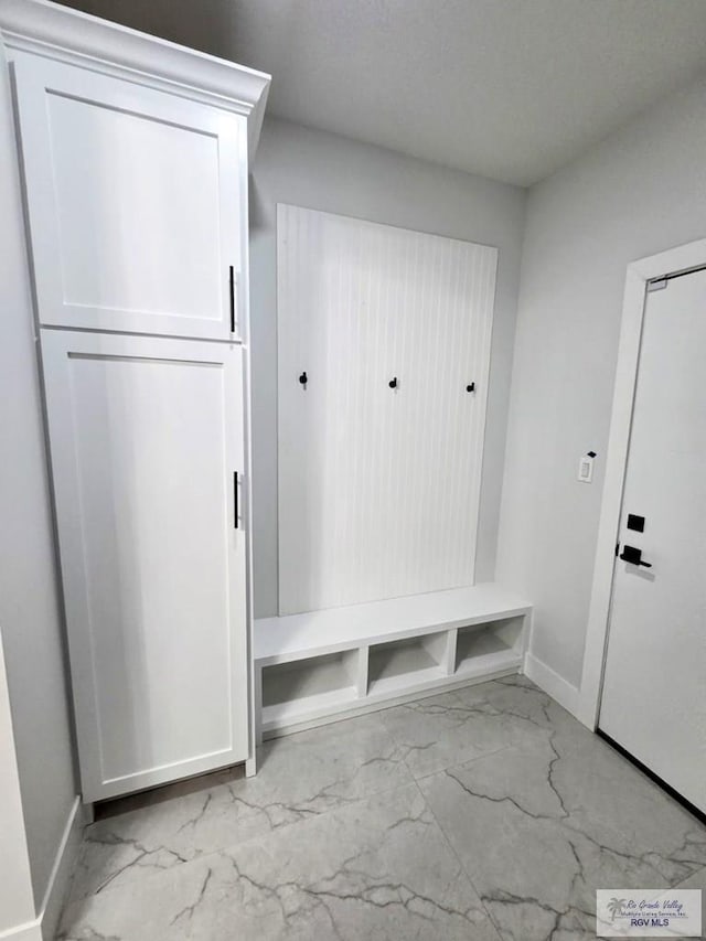 121 Finch Dr, Los Fresnos, TX 78566 - mudroom featuring light marble finish flooring and baseboards