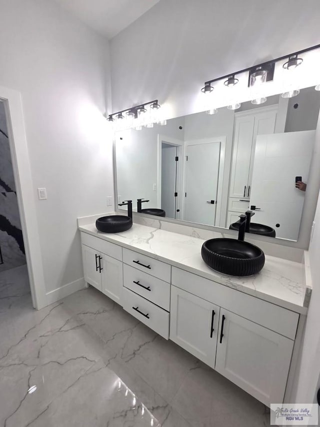 121 Finch Dr, Los Fresnos, TX 78566 - full bath with marble finish floors and double vanity