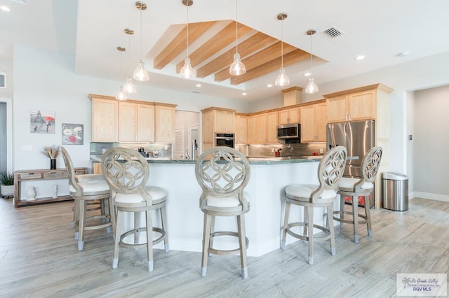 38 Spoonbill Cove Rd, Laguna Vista, TX 78578 - kitchen featuring appliances with stainless steel finishes, light brown cabinets, recessed lighting, light wood-type flooring, and tasteful backsplash