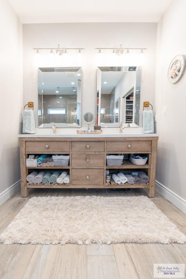 38 Spoonbill Cove Rd, Laguna Vista, TX 78578 - full bath featuring vanity, wood finished floors, and baseboards