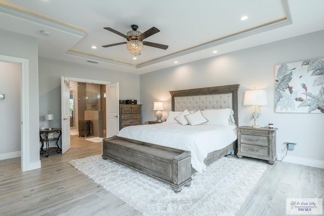 38 Spoonbill Cove Rd, Laguna Vista, TX 78578 - bedroom featuring a tray ceiling, baseboards, wood finished floors, recessed lighting, and a ceiling fan