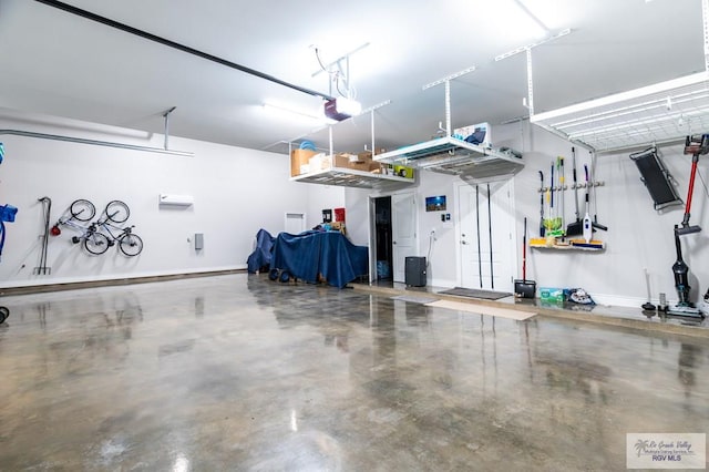 38 Spoonbill Cove Rd, Laguna Vista, TX 78578 - garage featuring a garage door opener and baseboards
