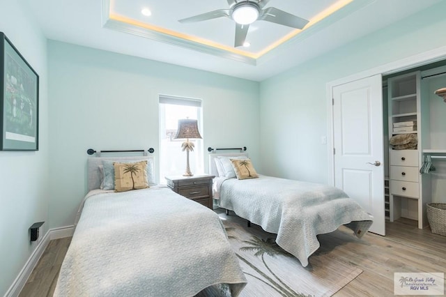 38 Spoonbill Cove Rd, Laguna Vista, TX 78578 - bedroom featuring a tray ceiling, wood finished floors, ceiling fan, baseboards, and recessed lighting