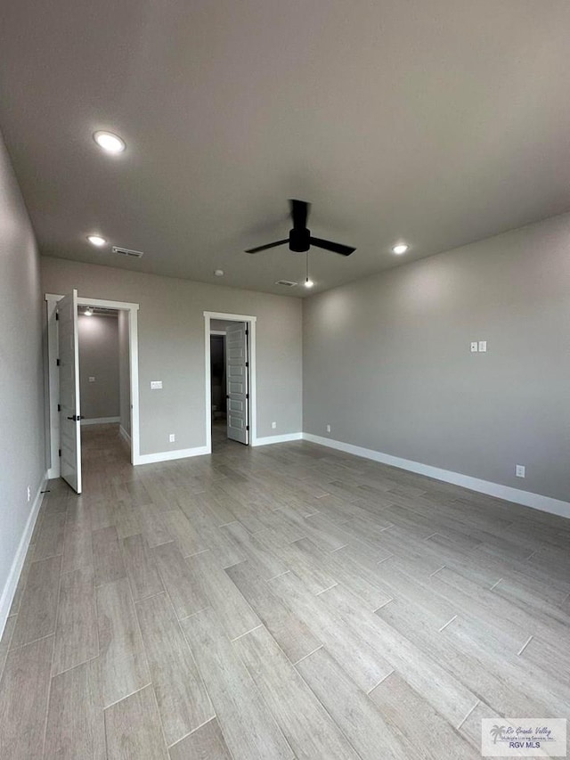 unfurnished room featuring light hardwood / wood-style floors and ceiling fan