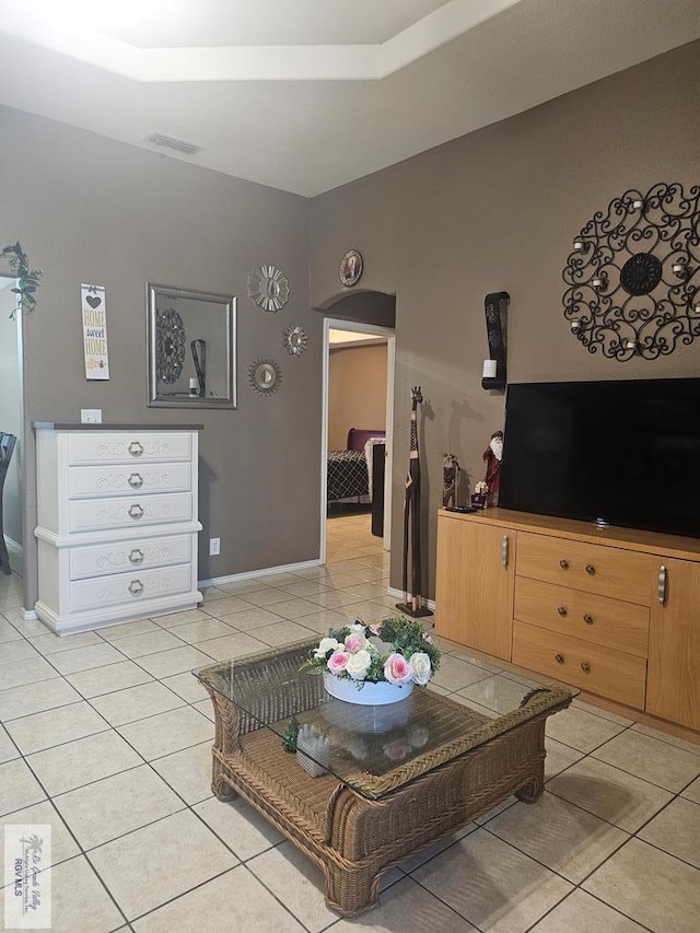 living room with light tile patterned floors