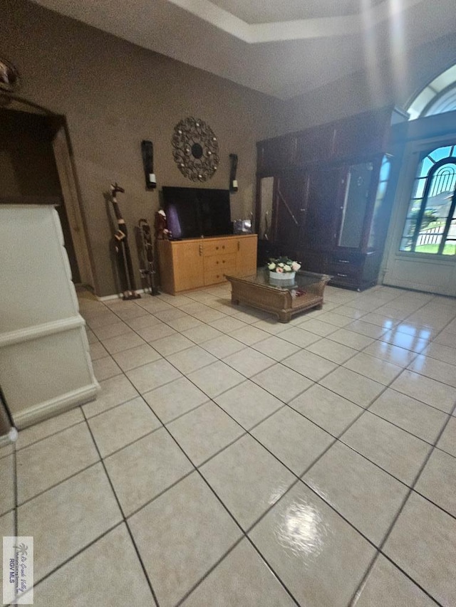 unfurnished living room with light tile patterned floors