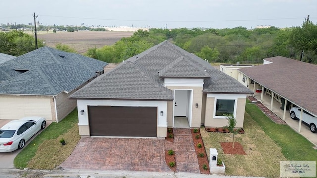 view of front facade with a garage and a front lawn