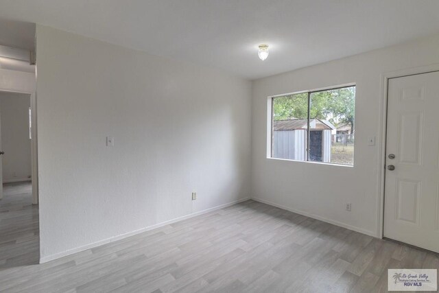 225 Chelo Dr, La Feria, TX 78559 - entrance foyer featuring baseboards and light wood-style floors