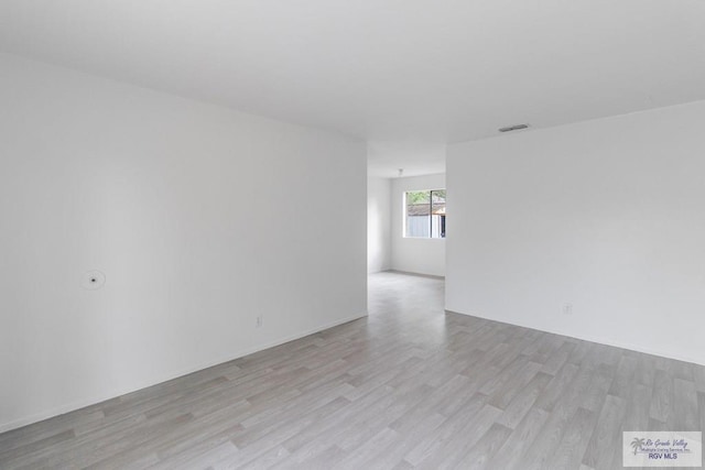 225 Chelo Dr, La Feria, TX 78559 - spare room featuring light wood finished floors and visible vents