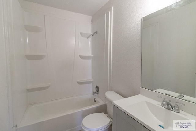 225 Chelo Dr, La Feria, TX 78559 - full bathroom with a textured wall, toilet, vanity, and washtub / shower combination