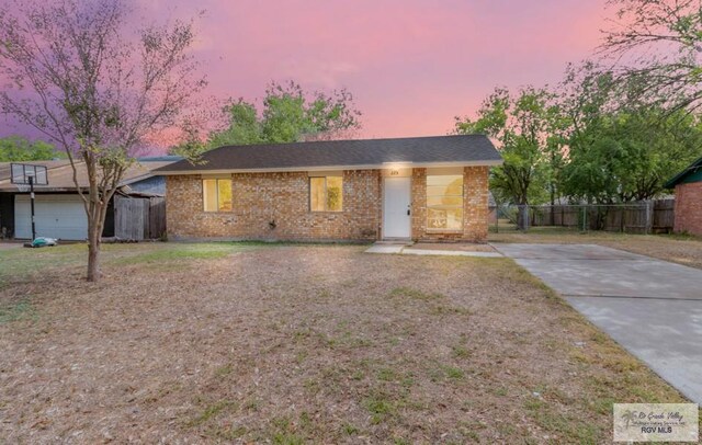 225 Chelo Dr, La Feria, TX 78559 - ranch-style house featuring fence and brick siding