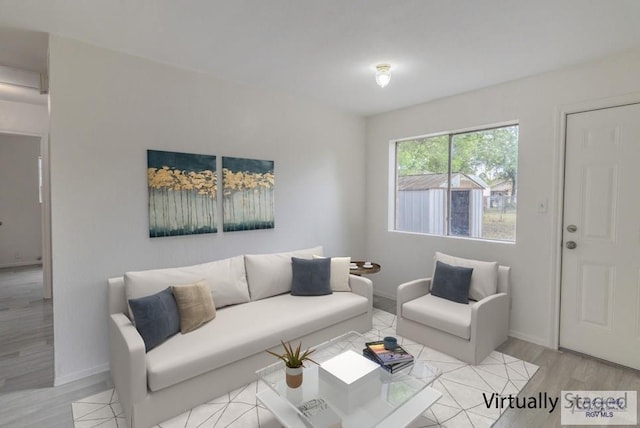 225 Chelo Dr, La Feria, TX 78559 - living area with baseboards and light wood-style floors
