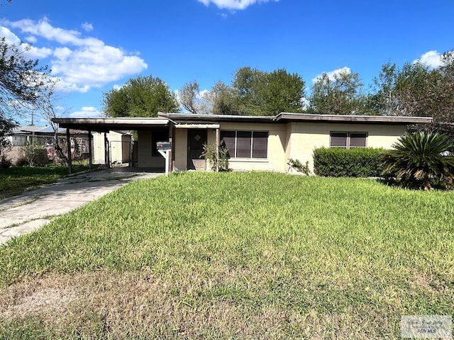 ranch-style house with a front lawn and a carport