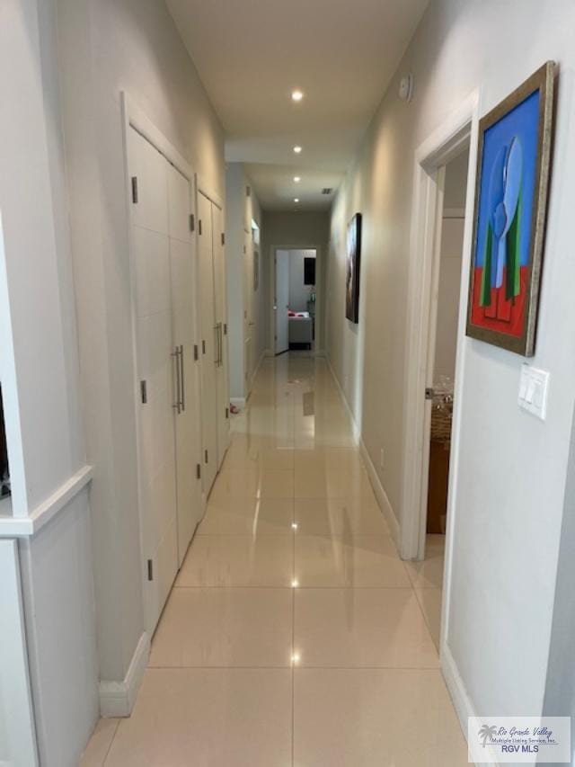 hallway with light tile patterned flooring