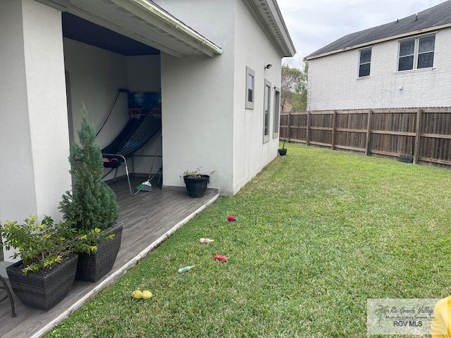 view of yard featuring a wooden deck