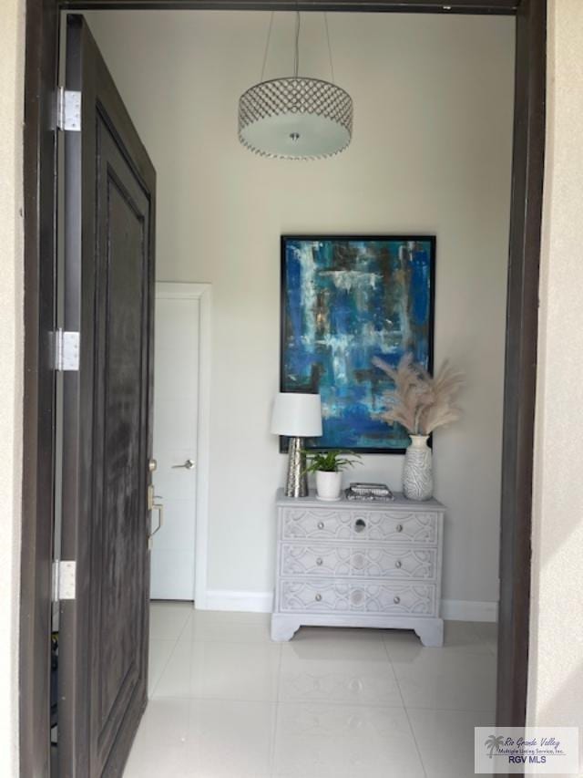 hall featuring light tile patterned floors