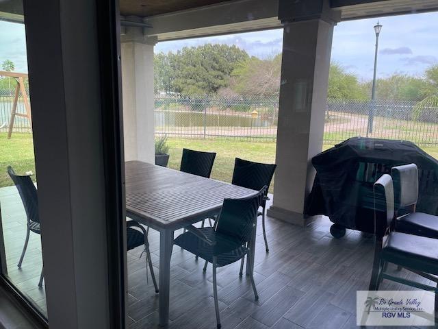 dining room with dark hardwood / wood-style floors