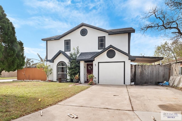 view of property with a garage and a front lawn