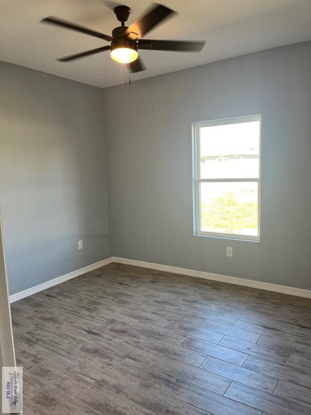 unfurnished room featuring hardwood / wood-style flooring and ceiling fan