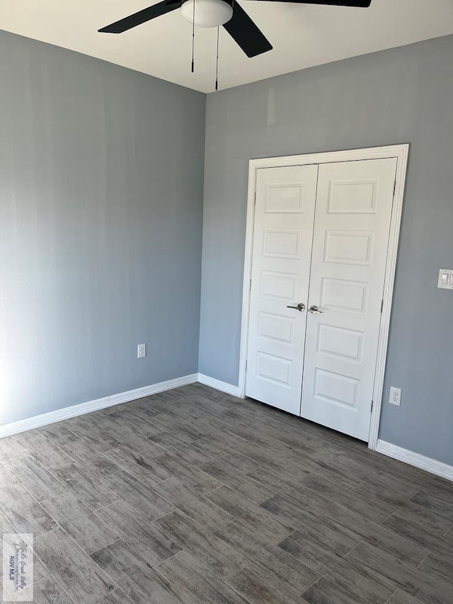 6214 Bentwood Dr, Harlingen, TX 78552 - unfurnished bedroom featuring dark wood-style flooring, a closet, and a ceiling fan