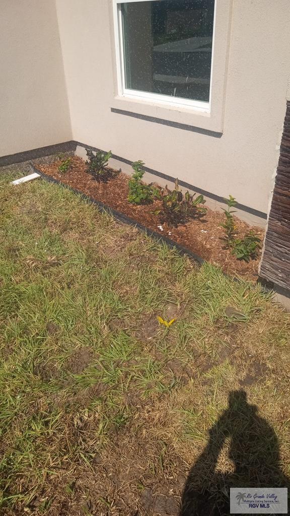 6214 Bentwood Dr, Harlingen, TX 78552 - exterior view of stucco siding