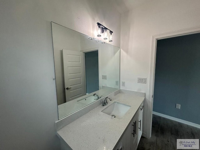 6214 Bentwood Dr, Harlingen, TX 78552 - bathroom featuring wood finished floors and vanity