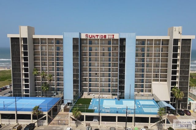 view of building exterior with a water view