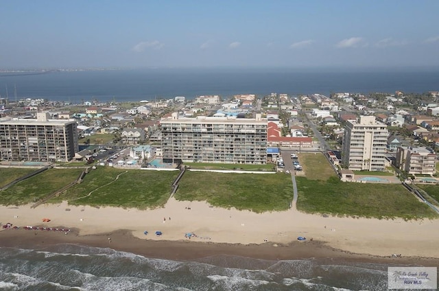 aerial view with a water view and a view of the beach