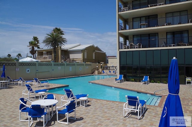 view of swimming pool with a patio