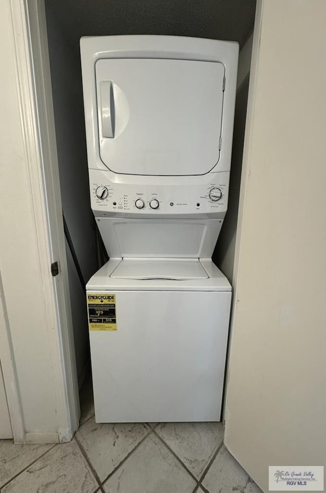 laundry room featuring stacked washer / dryer