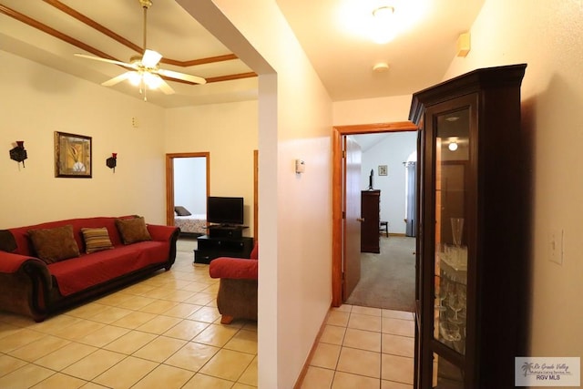 tiled living room featuring ceiling fan