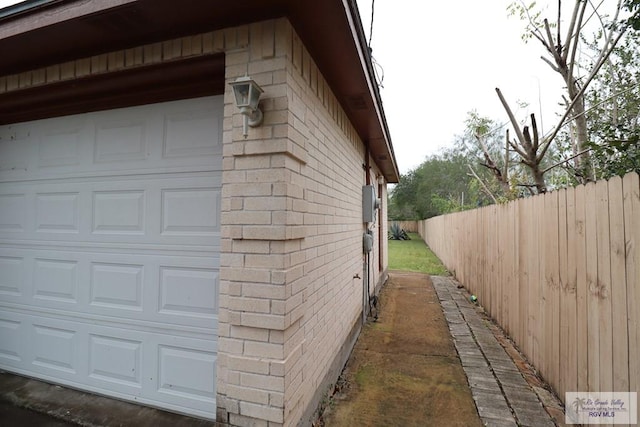 view of side of property featuring a garage