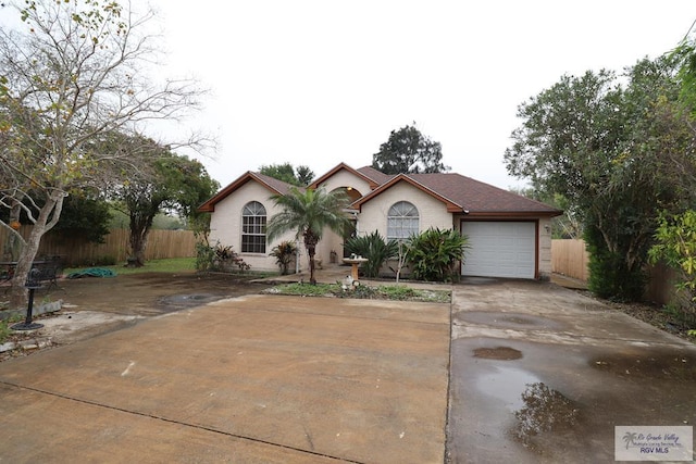 view of front of property featuring a garage